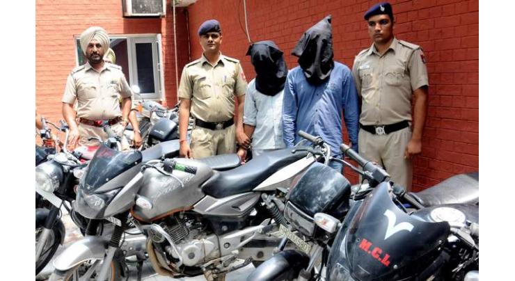 Two held, 12 motorcycles recovered