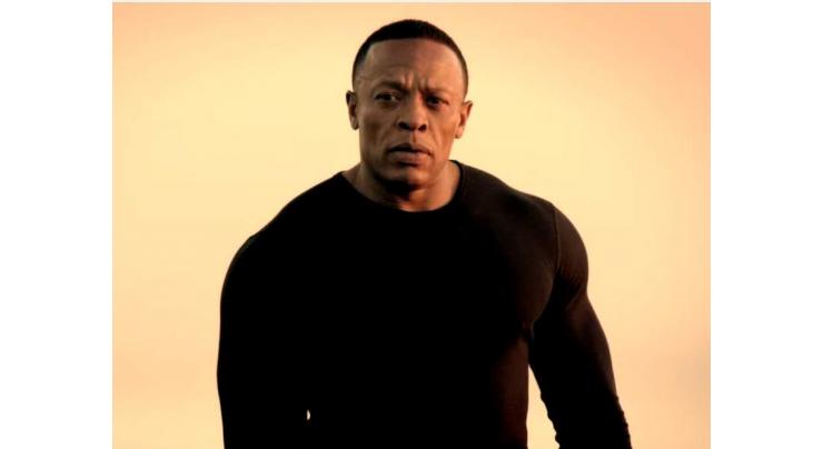 Rap tycoon Dr. Dre handcuffed outside home