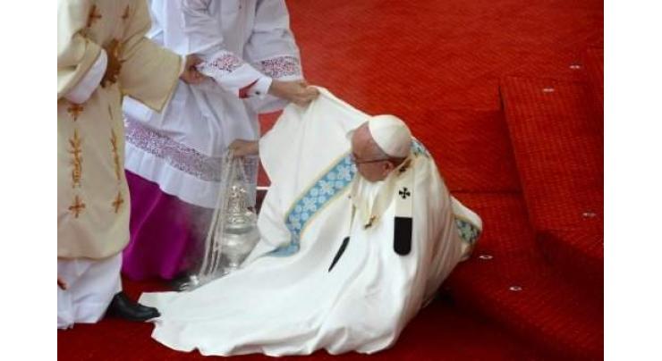 Pope Francis falls in Poland, escapes injury