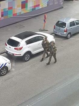 Brussels police surround 'bomb suspect', cordon off city centre