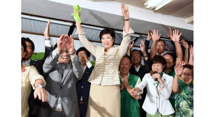 New Tokyo governor says defying party secured win