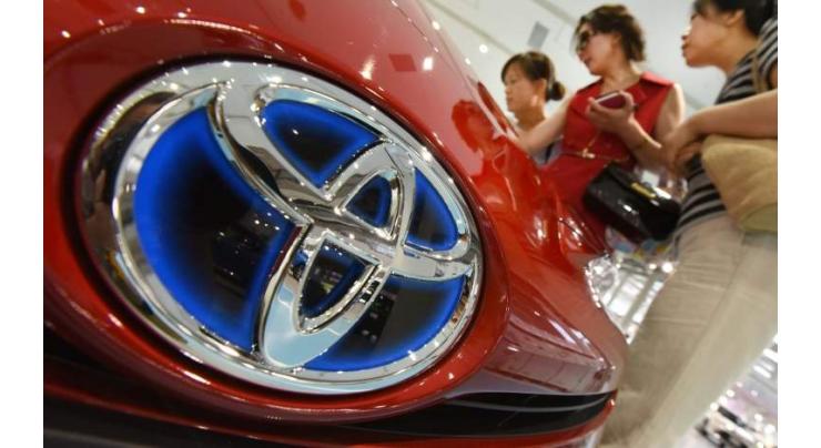 Toyota Q1 net profit down, cuts FY forecast on yen rally