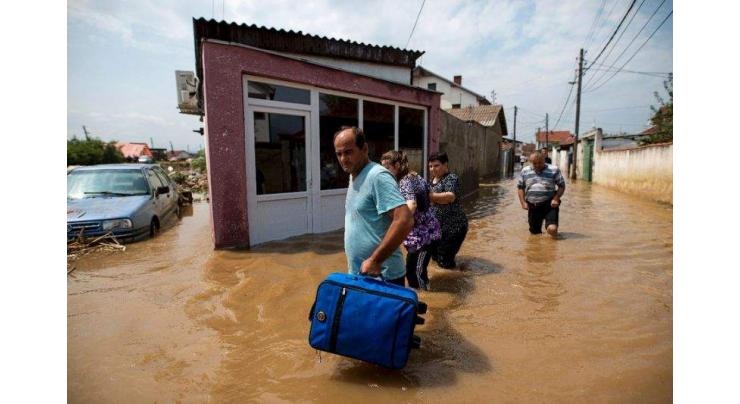 Macedonia mourns after storms kill 21