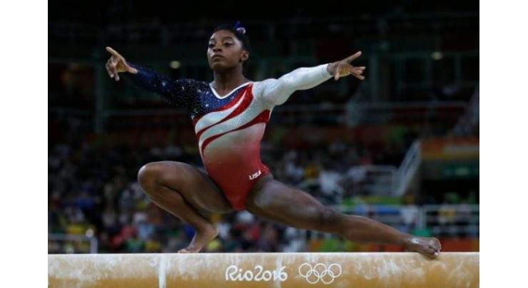 Olympics: Biles powers USA to gymnastics team gold