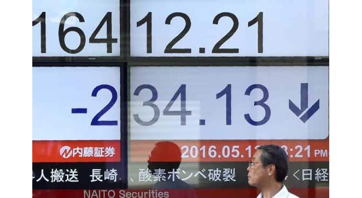 Tokyo stocks down by break as strong yen hits exporters