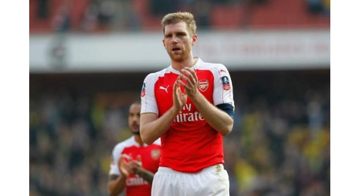 Football: Injured Mertesacker named Arsenal captain