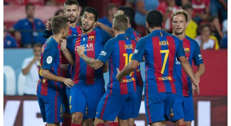 Football: Suarez gives Barcelona edge in Supercup