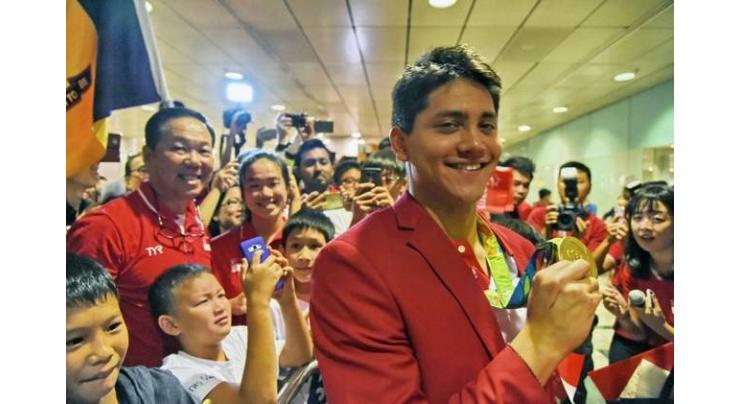 Olympics: Rousing welcome for Singapore star Schooling