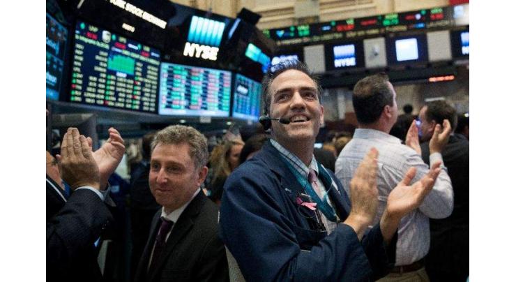 Wall Street hits new record highs