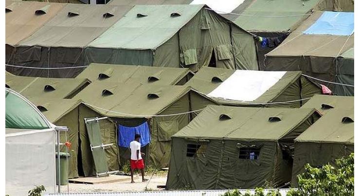 PNG says Australia agrees to close immigration camp
