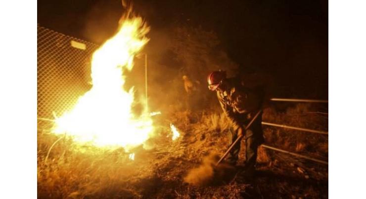 Firenadoes rage in California as blaze menaces 82,000