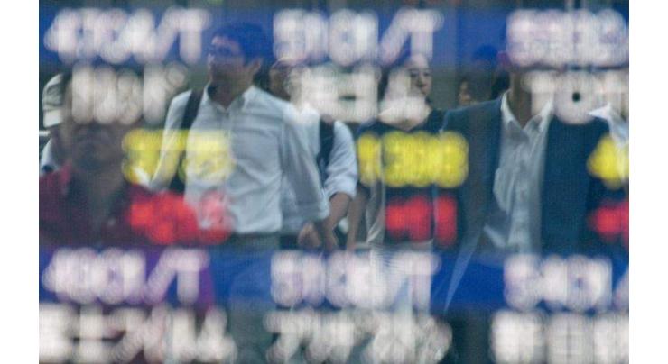 Asia stocks cautious after Fed minutes, Tokyo sinks