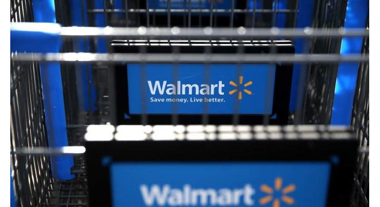 Wal-Mart boosts forecast on higher earnings; shares up