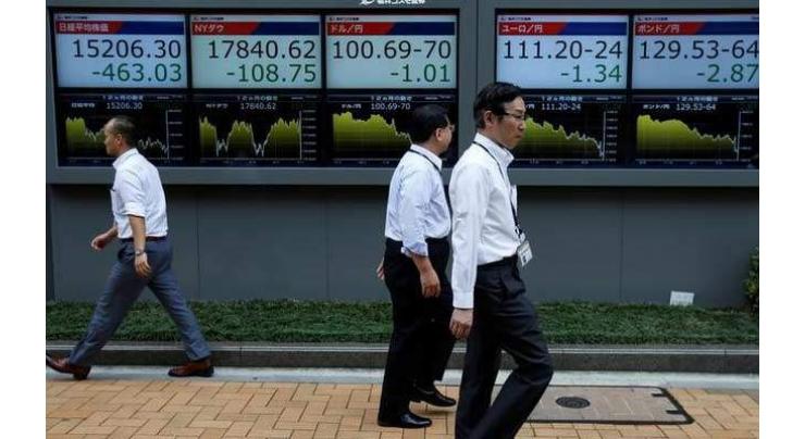Tokyo stocks open higher on weaker yen