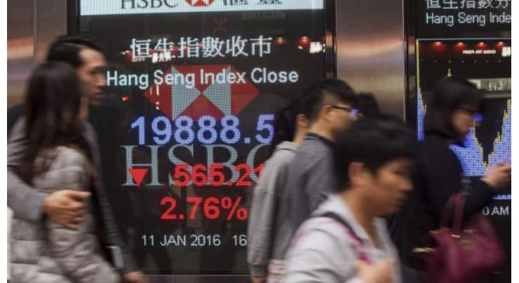 Hong Kong stocks down at lunch but Shanghai rises