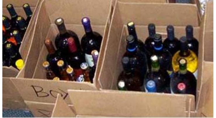 Liquor seized; 2 arrested