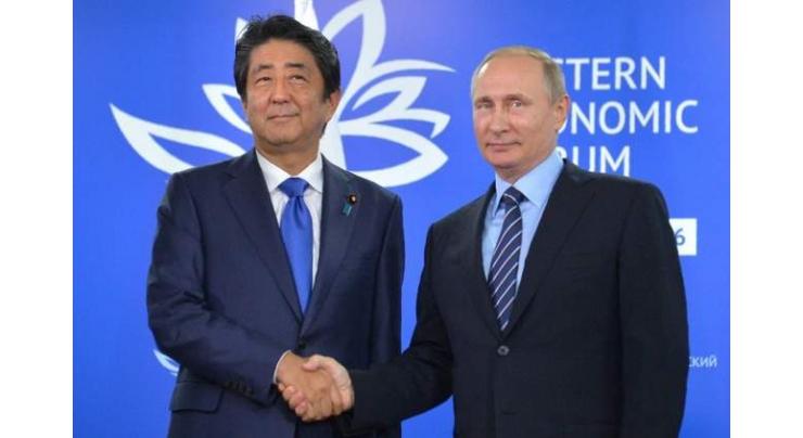 Putin, Abe seek progress on island row 