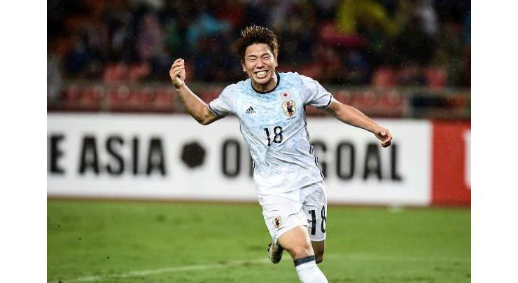 Football: Asano lays 'ghost goal' spectre to rest in Japan win 