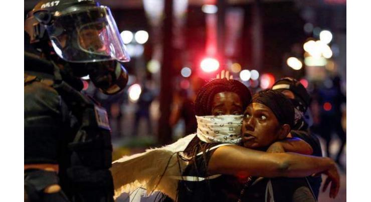 Protester shot amid Charlotte unrest on life support, not dead: city 