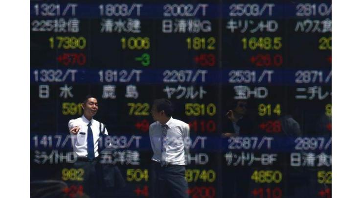 Tokyo stocks gain after Clinton gets nod in debate 