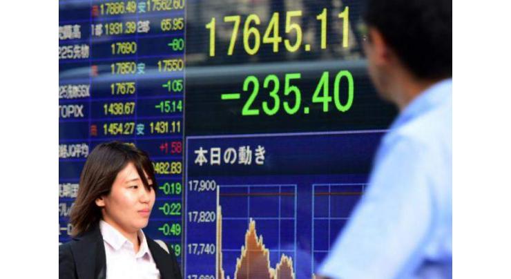 Tokyo shares sink by close as firms go ex-dividend 