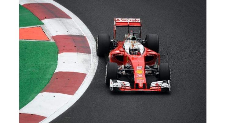 Vettel hands Ferrari boost, Hamilton edges Rosberg 