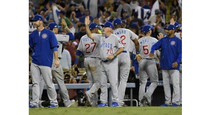 Baseball: Cubs find slugging form as elusive title one win away 