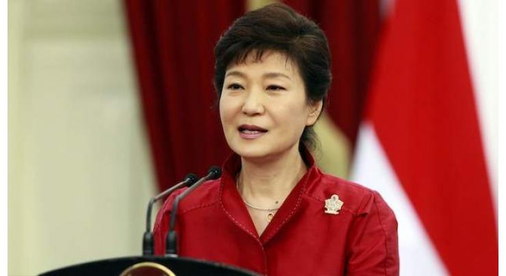 S. Korean president agrees to scandal probe, denies cult links 