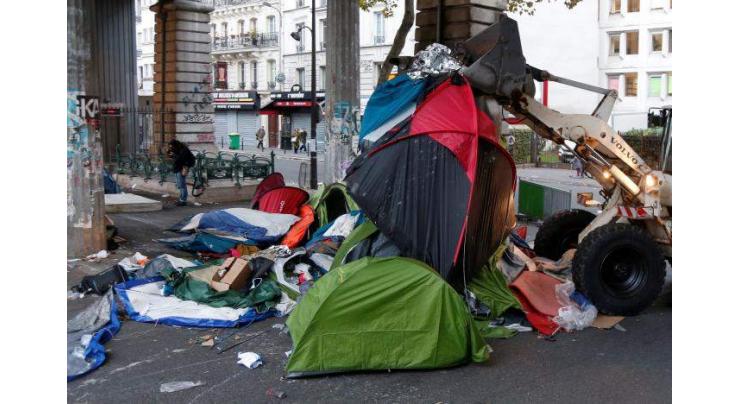 After Calais, France clears Paris migrant camp 