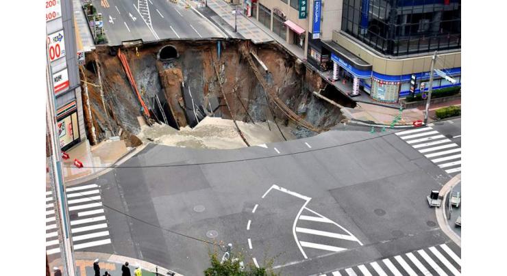 Giant sinkhole swallows Japan city street 