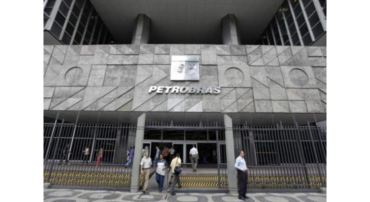 Brazil's Petrobras falls into red due to write-downs 