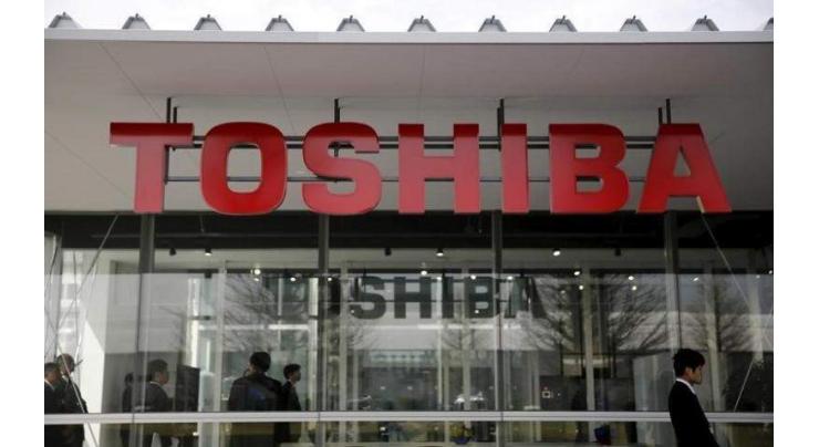 Toshiba first-half profit triples on asset sales 