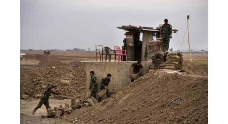 With shovels and bulldozers, Iraq Kurds draw line in sand 