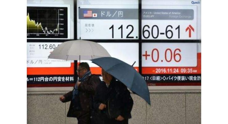 Asian markets struggle, but dollar rally lifts Tokyo 