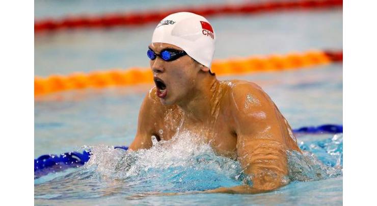 Chinese swimmer Wang Shun wins gold at Windsor in men's medley 200m 