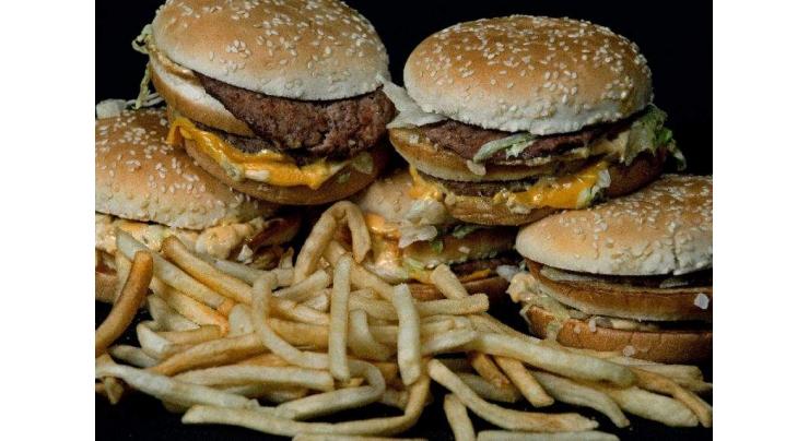 UK bans online ads for junk food targeting children 