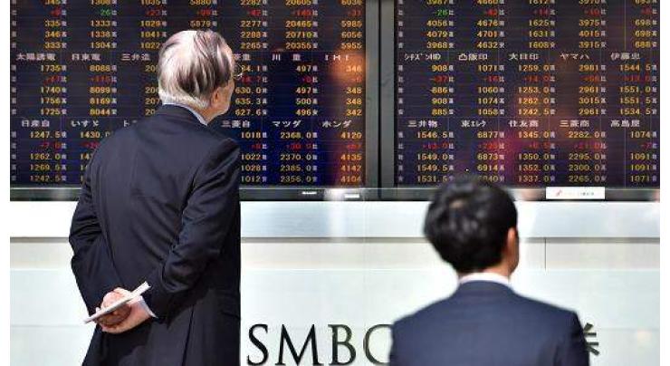 Tokyo stocks edge higher after Fed rate hike 