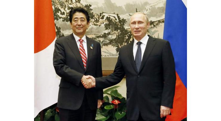 Putin, Abe to hold hot spring meet on WWII island row 