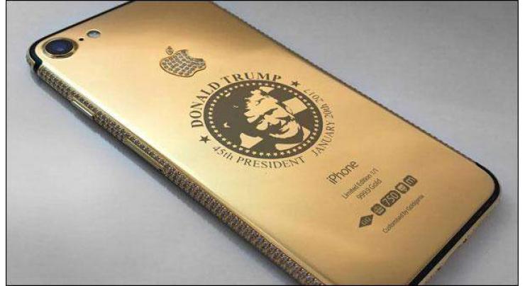 here comes gold Iphone 7 attributed to the new US president Donald trump with his picture on the back
