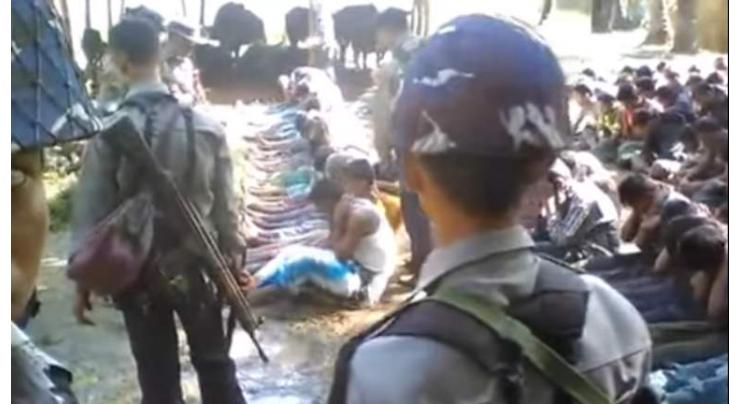 Myanmar detains police over Rohingya abuse video 