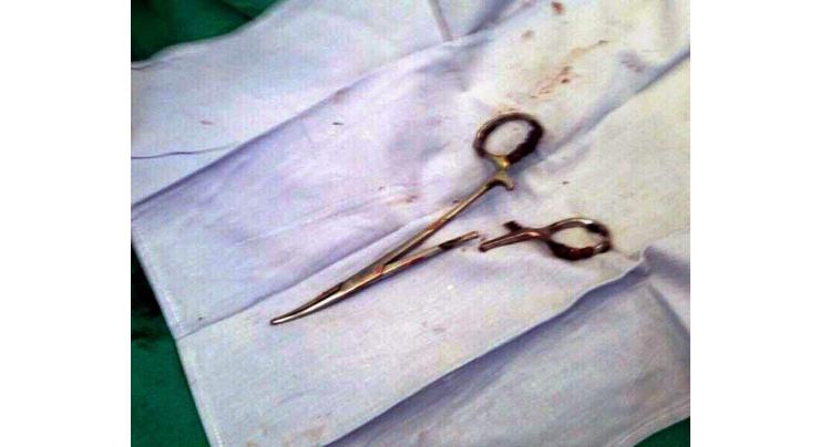 Scissors pulled from Vietnam man's stomach 18 years after surgery 