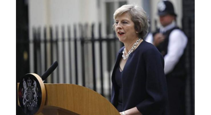 May defends Pounds 300 mln aid for Pakistan 