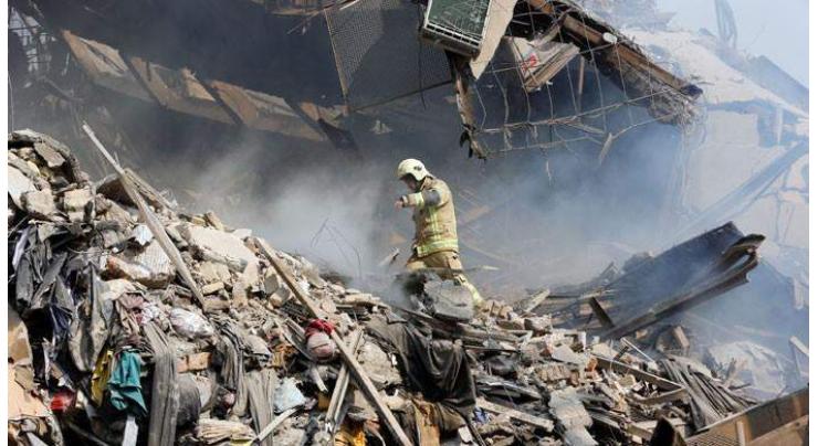 Many Iran firefighters feared trapped in building collapse 