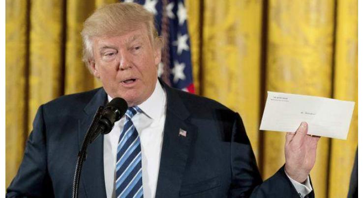 Trump vows to cherish a 'beautiful letter' left by Obama 