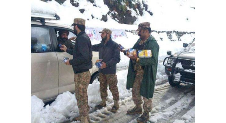 Chitral police rescued 20 families stranded in heavy snow at Lawari top 