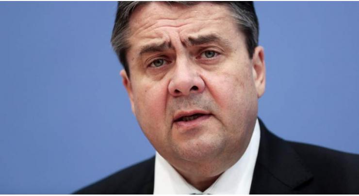 Gabriel named foreign minister after ruling out Merkel challenge 