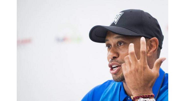 Woods misses cut, Rose holds lead at Torrey Pines 