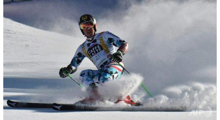 Alpine skiing: Hirscher claims first giant slalom title 