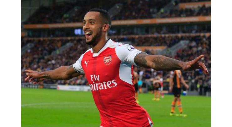 Ton-up Walcott ends Sutton's FA Cup dream 