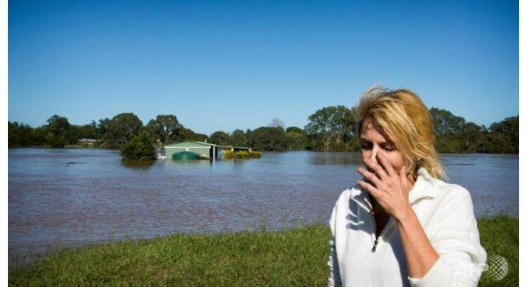 Australia floods still rising with two dead, four missing 